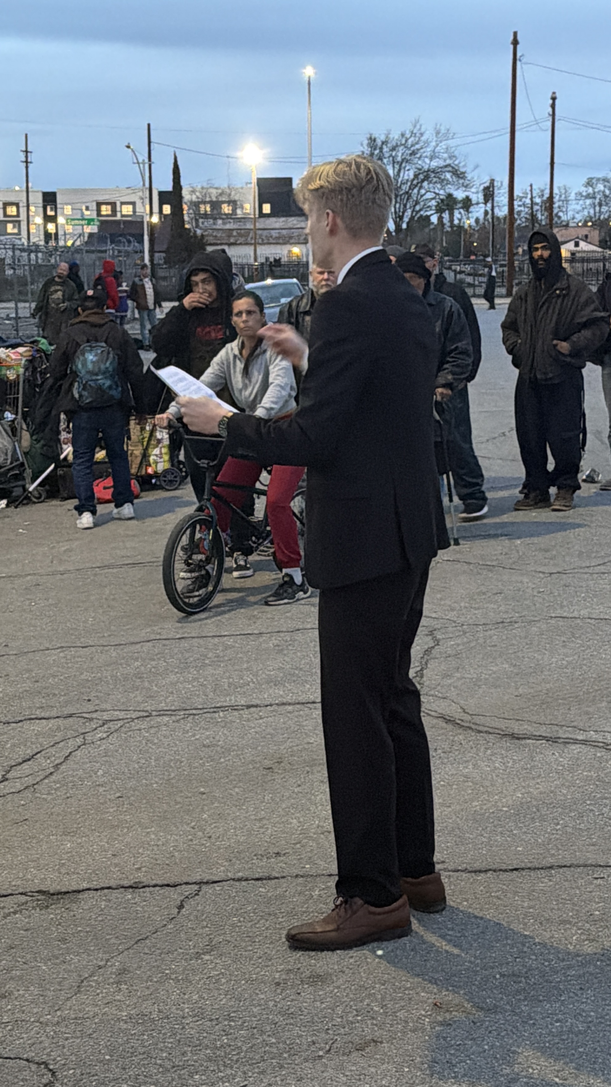 Seth speaking with homeless residents at his campaign launch
